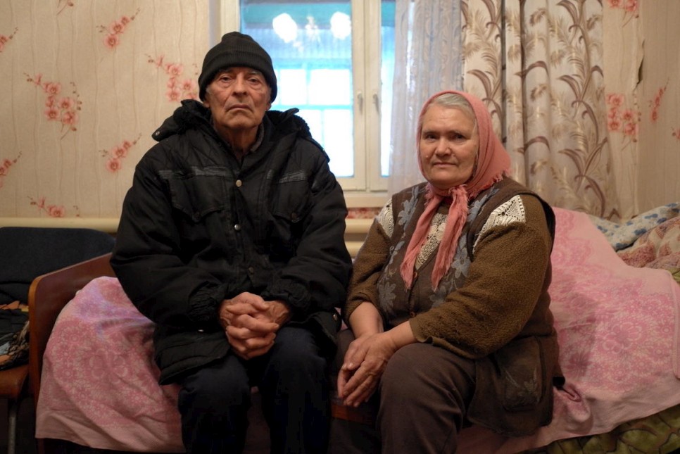 elderly couple sitting