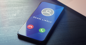 a cellphone with the caller ID "Scam Likely"